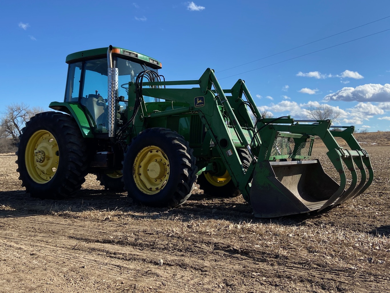 Lot 4020788 '95 JD 7400 MFWD w/JD 740 SL Loader. OnsiteBelle Fourche SD American Ag Video