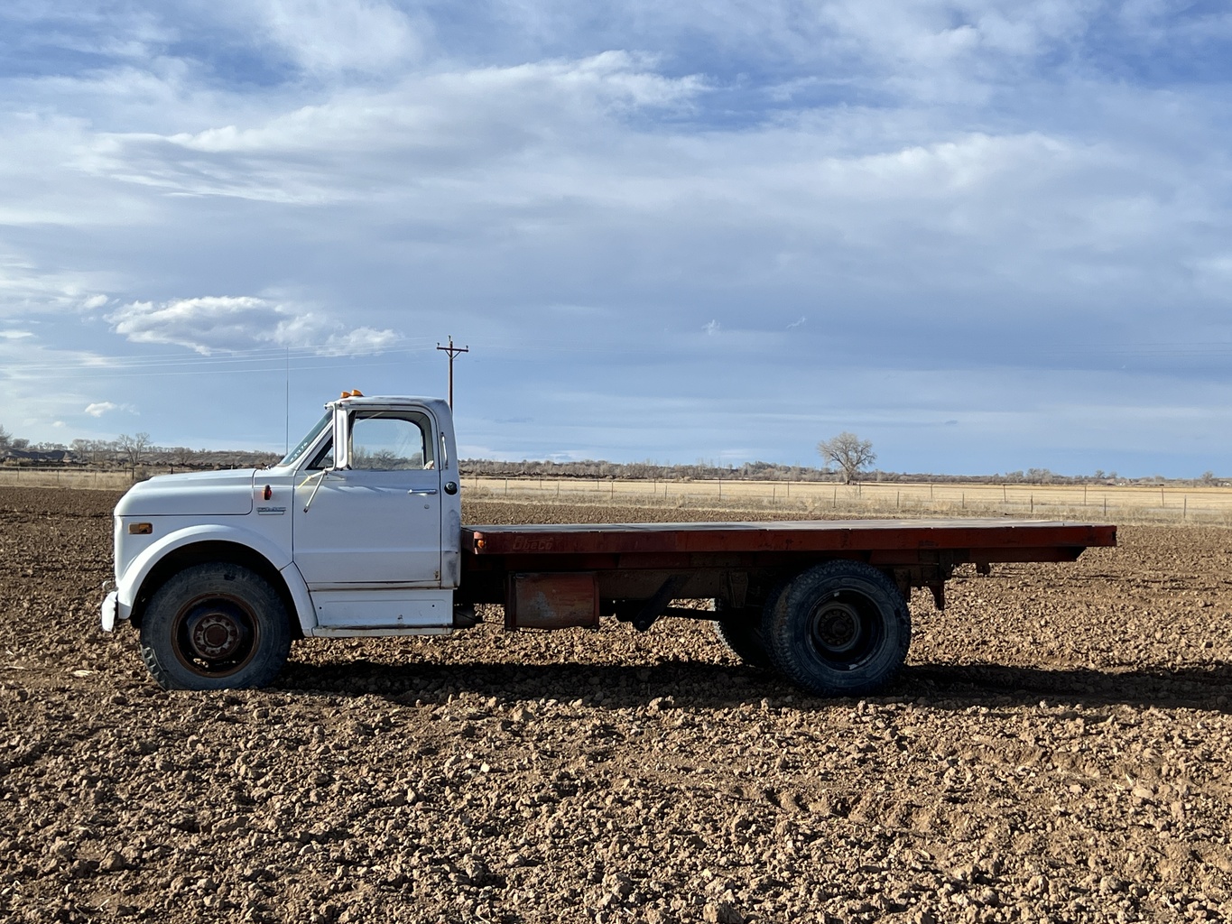 Lot 3976 - 1972 GMC 5500 Flatbed Dump Truck. Burlington, WY