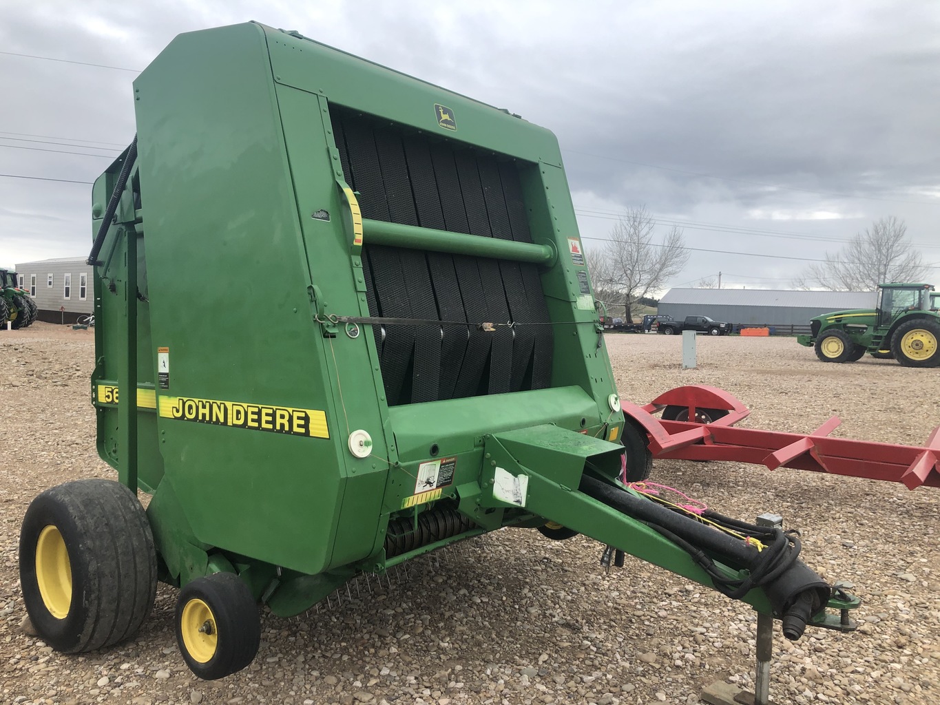 Lot 5657100 '98 JD 566 ROUND BALER. OnsiteBelle Fourche SD AMERICAN AG ANNUAL SUMMER HAY